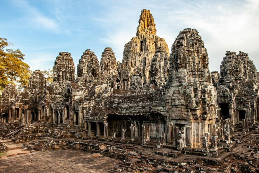 a large group of stone buildings surrounded by trees