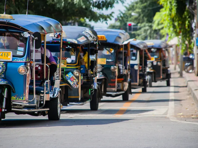 blue-and-yellow autorickshaws