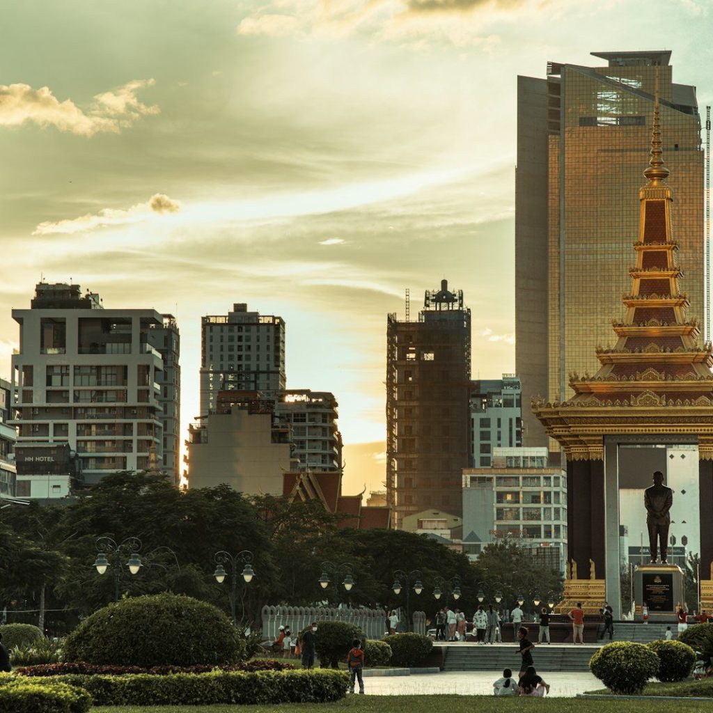 a city with tall buildings and a clock tower