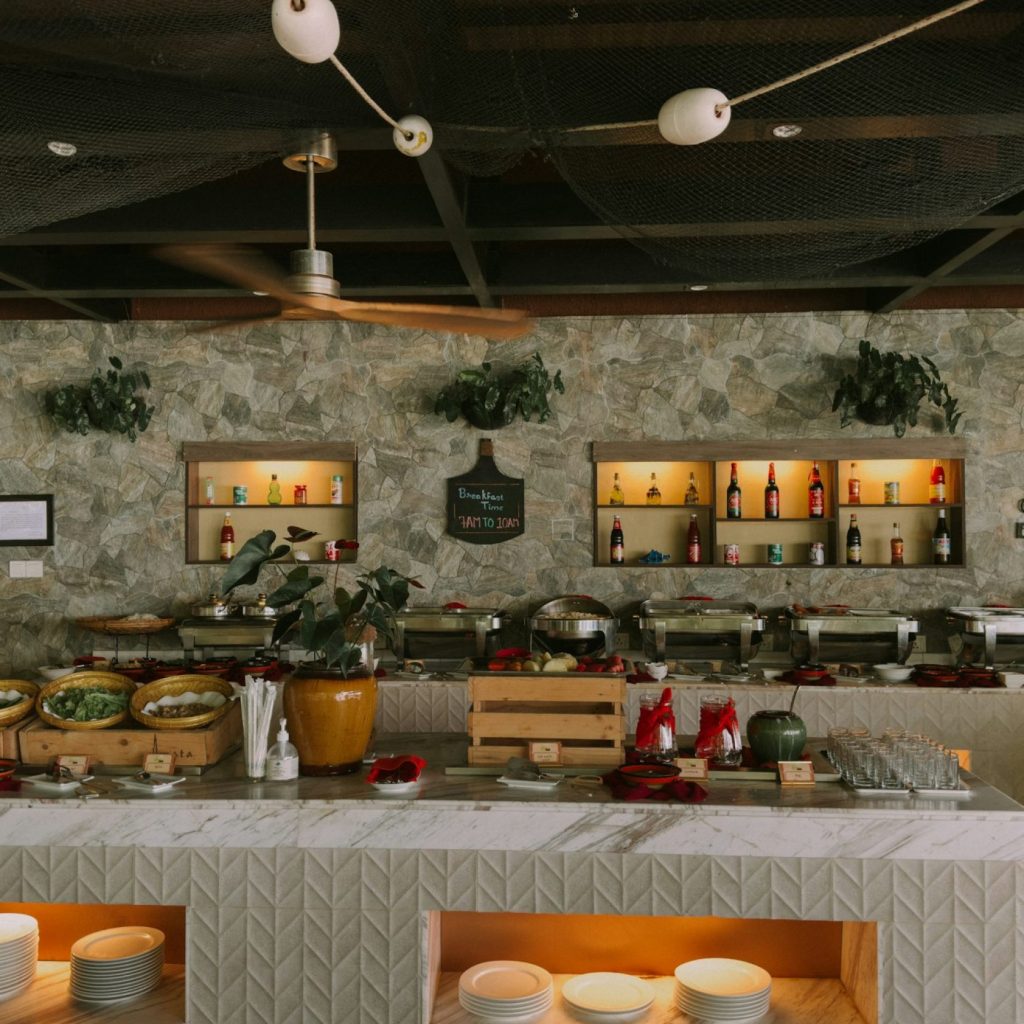 a buffet area with a variety of food items