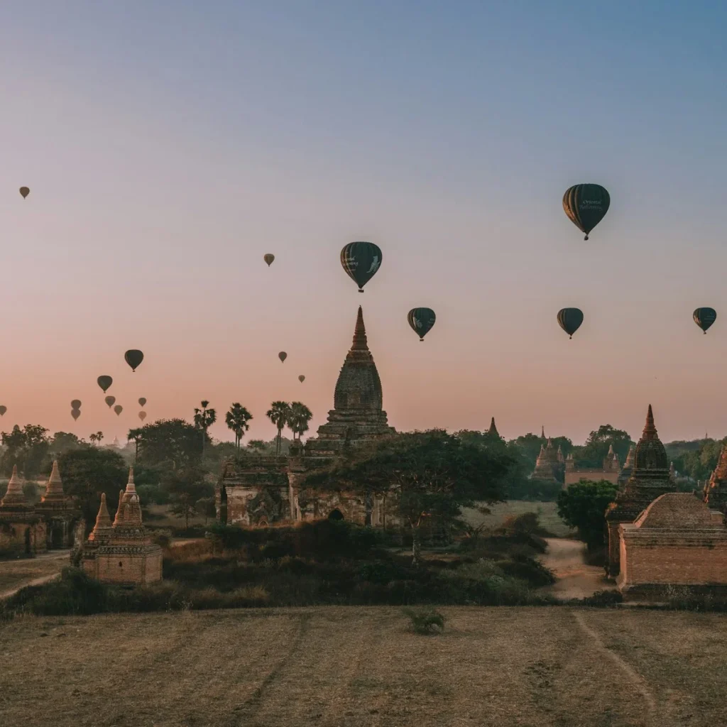 hot air balloons in the sky during sunset