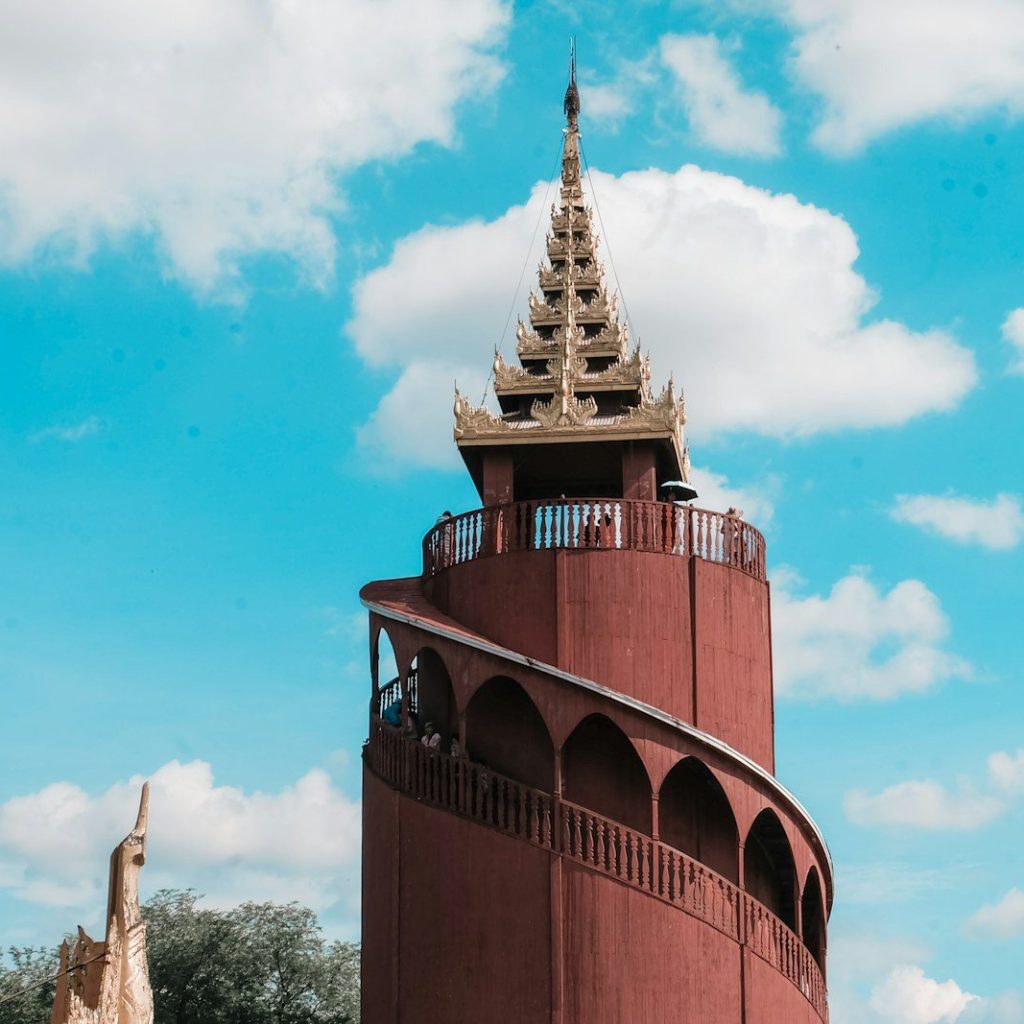 red and brown tower at daytime