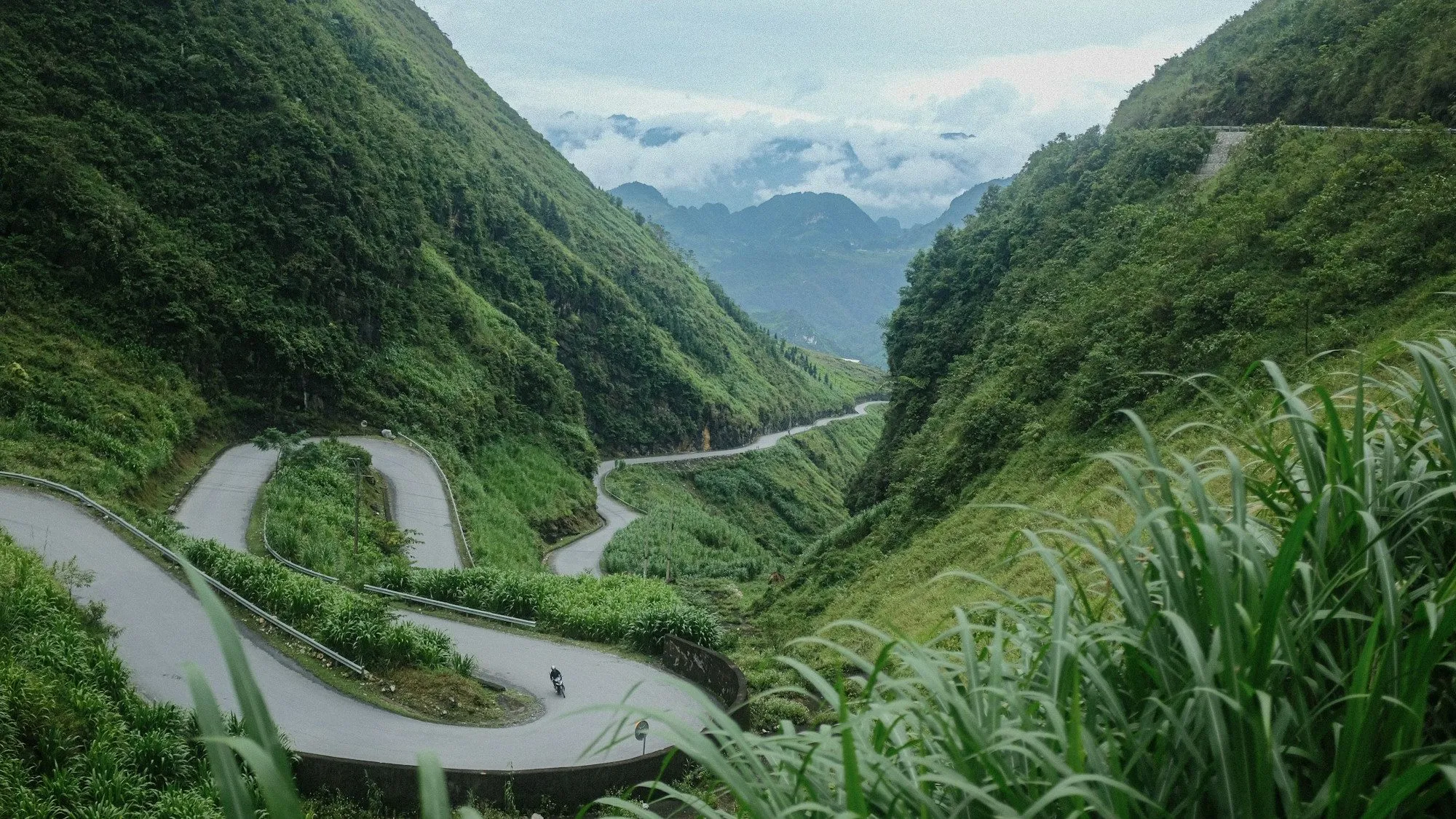 a winding road through a valley