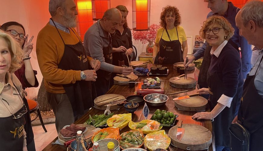 Metta Voyage group cooking class under lanterns