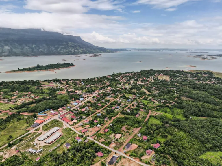 a bird's eye view of a small town near a body of water