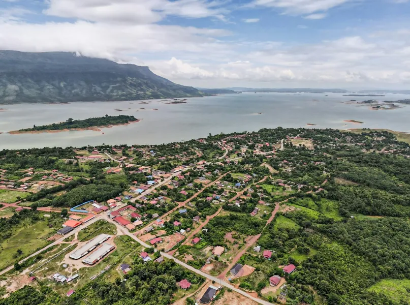 a bird's eye view of a small town near a body of water