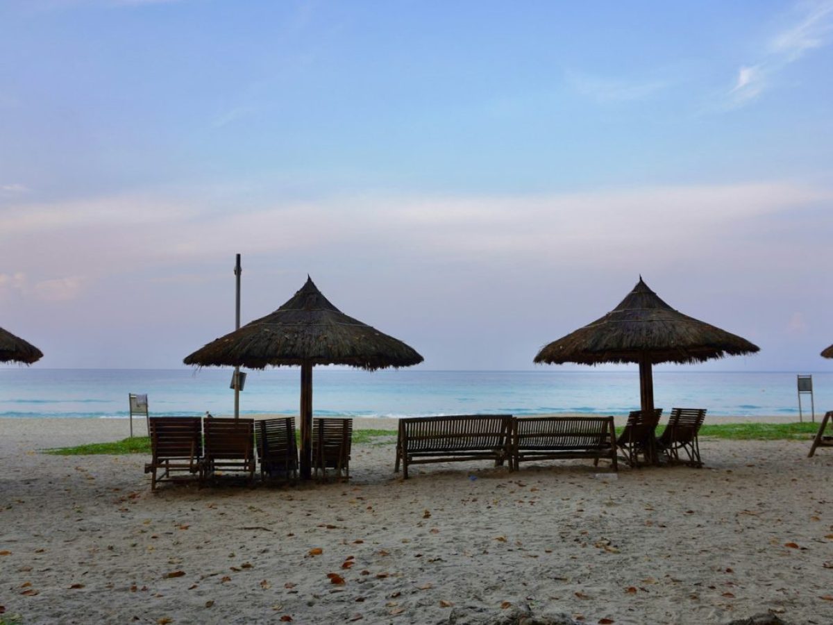 a bunch of umbrellas that are on a beach