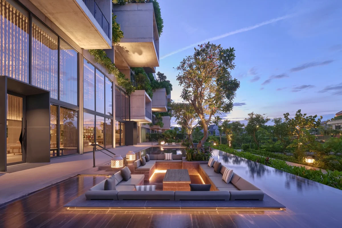 Reflection pool and sunken lounge at NHAAN Resort & Spa Hoi An at dusk
