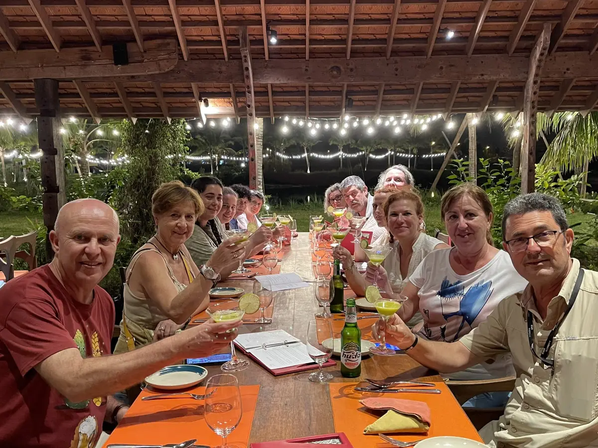 Metta Voyage guests raising a toast at dinner